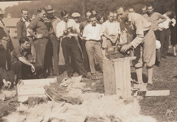 A Black & Decker representative demonstrates the use of a new power tool, c. 1920s
